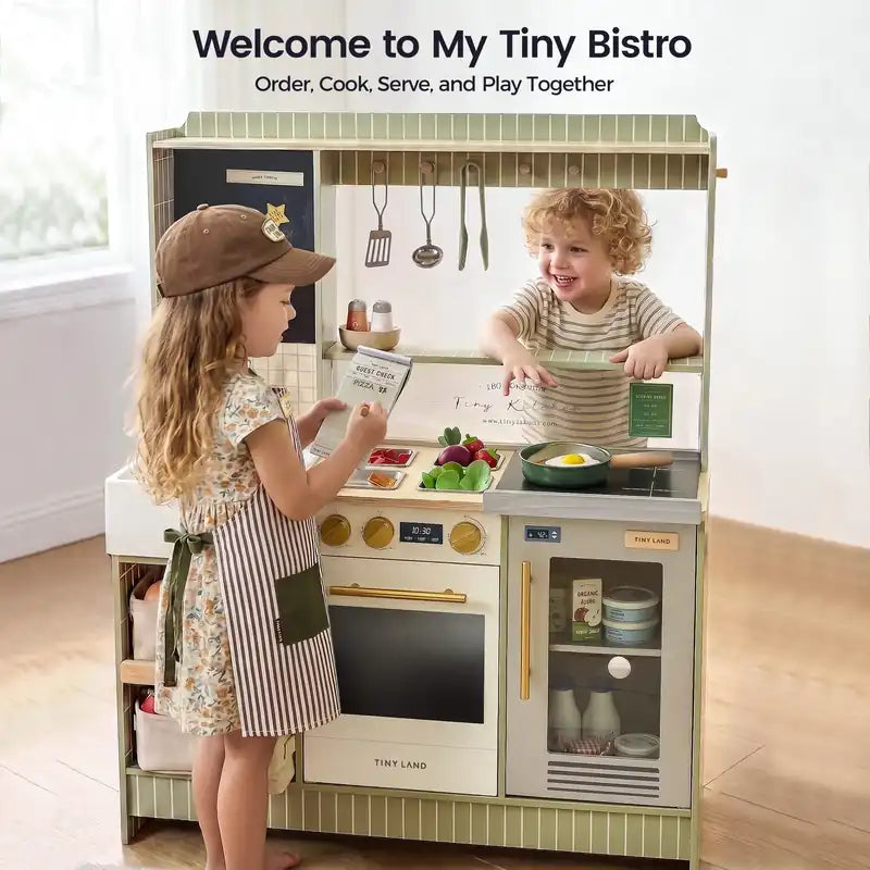 Tiny Land® BistroSwitch Play Kitchen – Two children taking an order at the Green kitchen