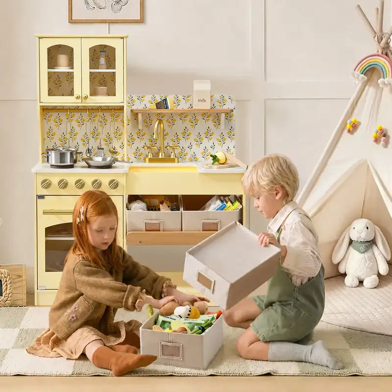 Tiny Land® Wooden Play Kitchen with Storage for Creative Toddlers – Two children with removable bins beside the Pale Yellow kitchen