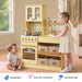 Tiny Land® Wooden Play Kitchen with Storage for Creative Toddlers – Two children beside the Pale Yellow kitchen