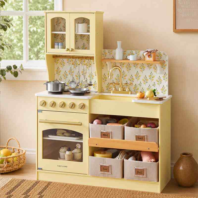Tiny Land® Wooden Play Kitchen with Storage for Creative Toddlers – Pale Yellow kitchen with floral panels, four bins and staged play food