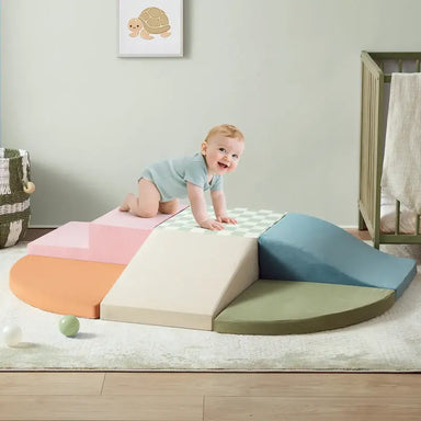 Tiny Land® PlayNest Climbing Blocks - Morandi – child crawling across the Morandi foam block arrangement