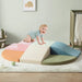 Tiny Land® PlayNest Climbing Blocks - Morandi – child crawling across the Morandi foam block arrangement