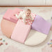 Tiny Land® PlayNest Climbing Blocks - Violet – overhead view of a child playing on the Violet foam blocks