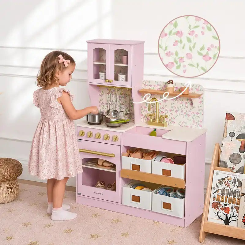 Tiny Land® Wooden Play Kitchen with Storage for Creative Toddlers – Child at the Sakura Pink kitchen with a floral-panel detail