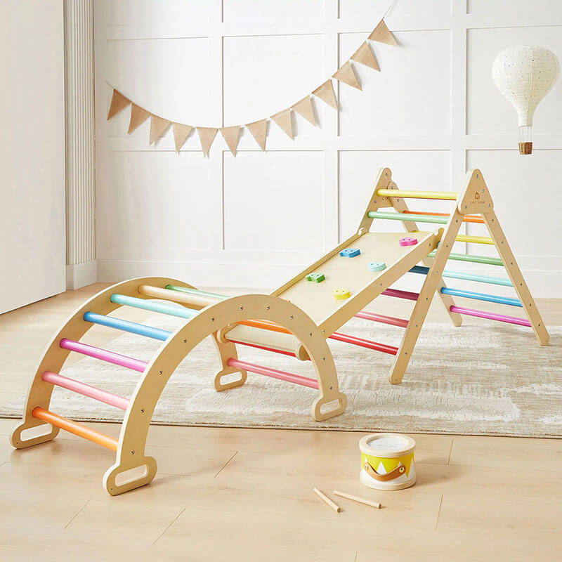 Tiny land Pikler triangle with rainbow colors in a playroom