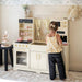 tiny_land_iconic_kitchen_cream_kitchen_front_view_girls_playing