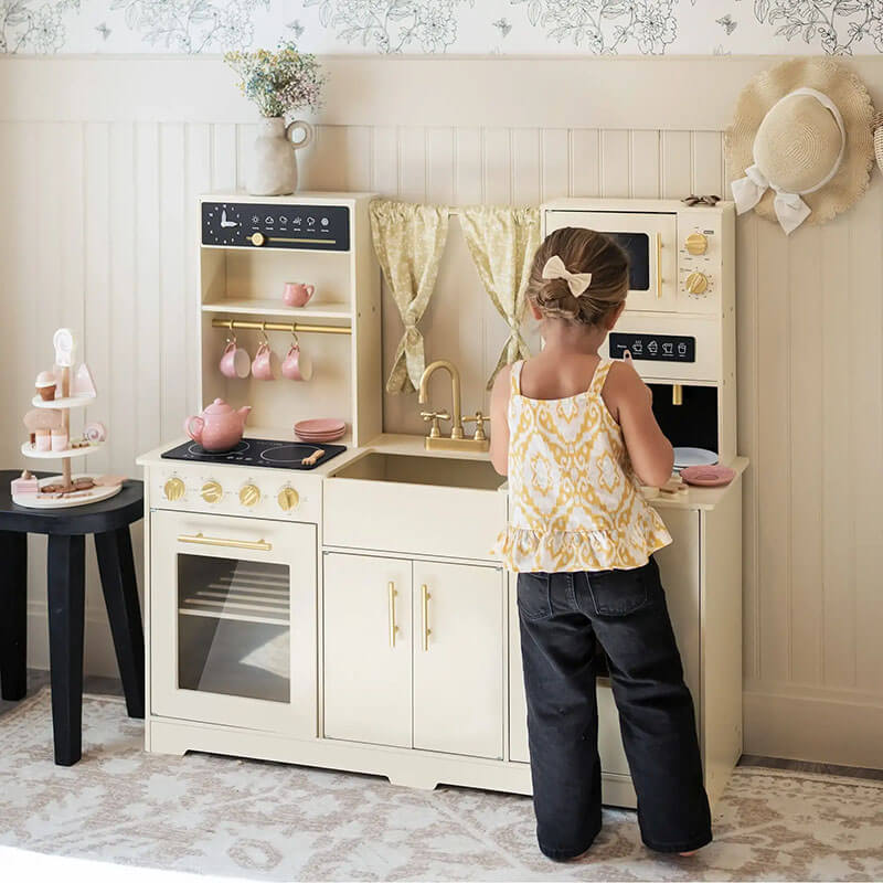 tiny_land_iconic_kitchen_cream_kitchen_front_view_girls_playing