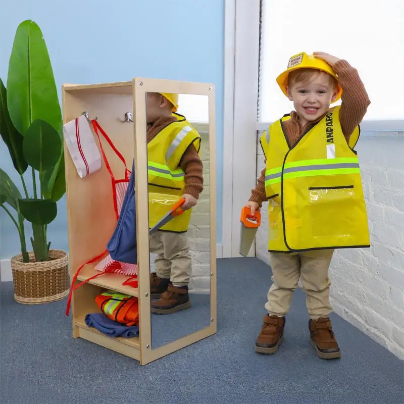 Toddler Dress Up Center WB0880 – Child dressed as a construction worker beside the mirror
