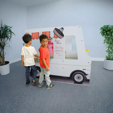 Imagination Truck - WB1140 – Kids ordering at the pretend taco truck window