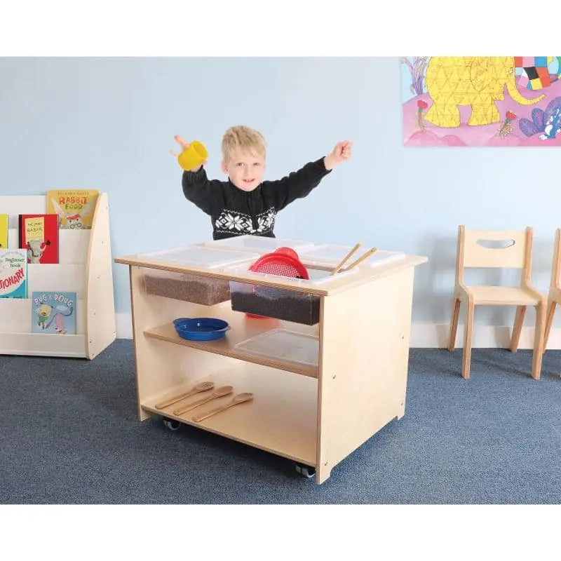 Whitney Brothers Mobile Sensory Play Table With 4 Trays and Lids (WB1775) – Child playing at the four-tray sensory table in a classroom