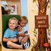 Treehouse Reading Nook - WB1531 – two kids seated inside beside the green cushioned backrest