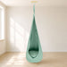 Wood and Hearts Pod Swing – Forest Green hanging pod and seat opening in a room