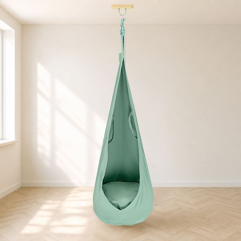 Wood and Hearts Pod Swing – Forest Green hanging pod and seat opening in a room