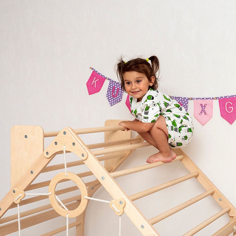 wooden_climbing_playhouse_girl_close_up_view_on_top