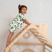 wooden_climbing_playhouse_girl_on_top_close_up