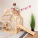 wooden_climbing_playhouse_side_view_girl_playing_on_top
