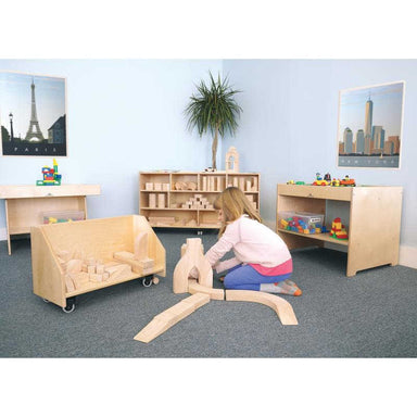 girl playing with wooden building blocks