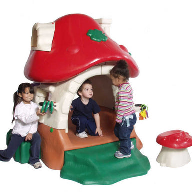 Tot Town Mushroom Kottage Playhouse with kids playing in it