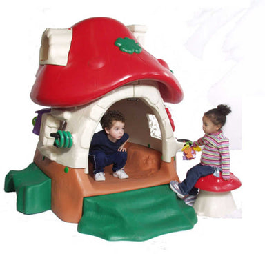 Tot Town Mushroom Kottage Playhouse with kids playing in it
